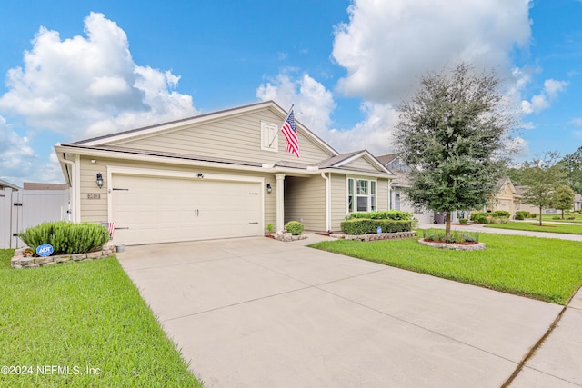 view of front of house with a front lawn and a garage