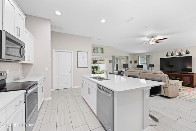 kitchen featuring appliances with stainless steel finishes, sink, ceiling fan, and white cabinets