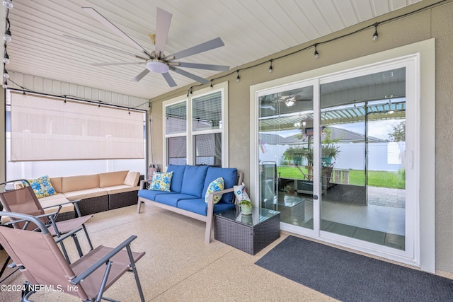 sunroom featuring ceiling fan