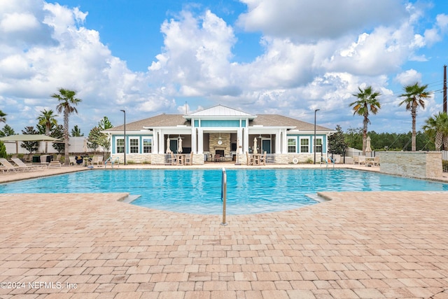 view of swimming pool with a patio