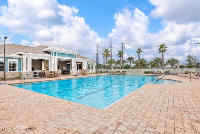 view of pool featuring a patio