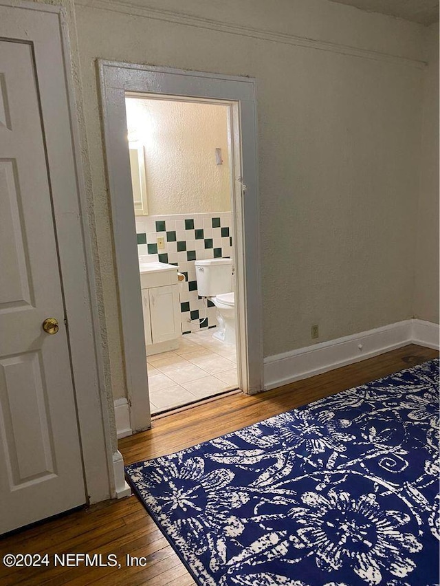 hallway featuring wood-type flooring