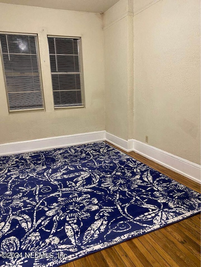 spare room featuring hardwood / wood-style flooring