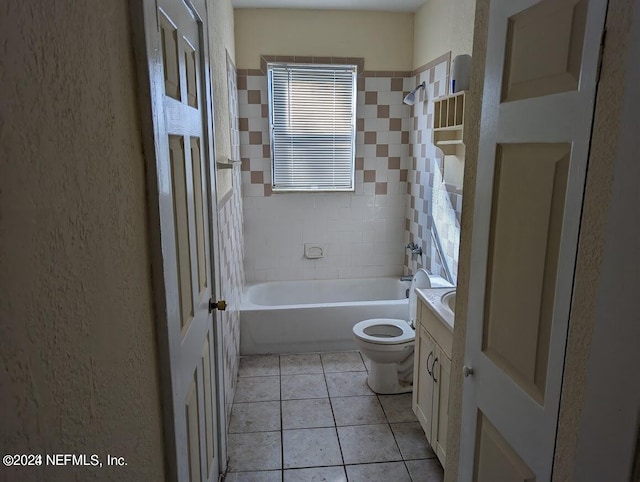 full bathroom with tiled shower / bath combo, vanity, toilet, and tile patterned flooring