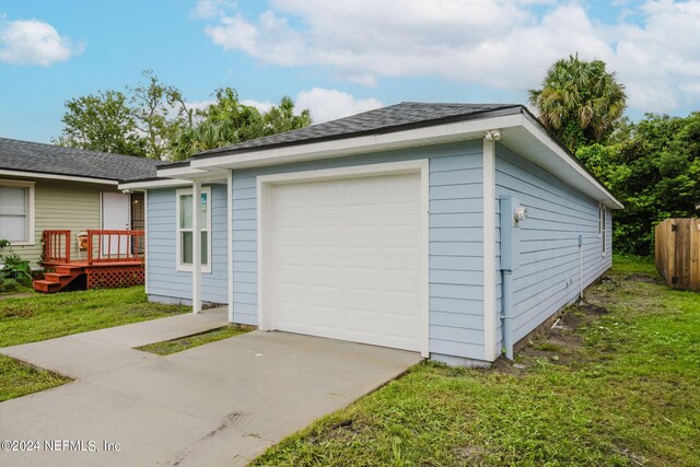 garage featuring a yard