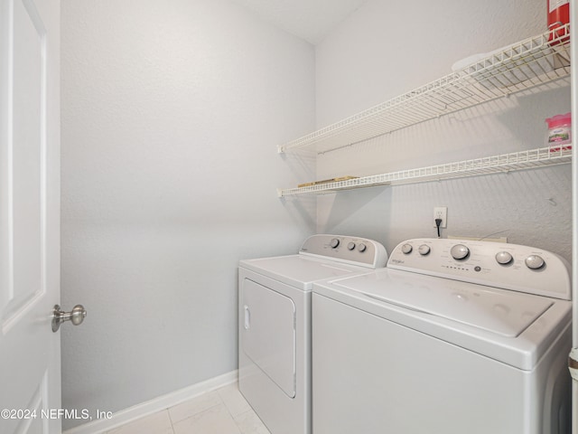 laundry area with washing machine and clothes dryer