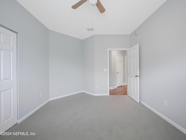 carpeted empty room with ceiling fan