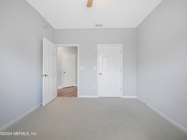 unfurnished bedroom featuring ceiling fan and carpet floors