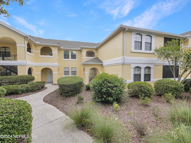 view of front of home with a balcony