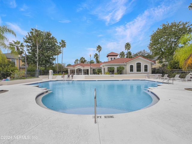 view of swimming pool with a patio