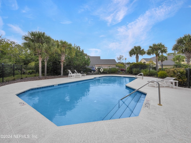 view of pool featuring a patio