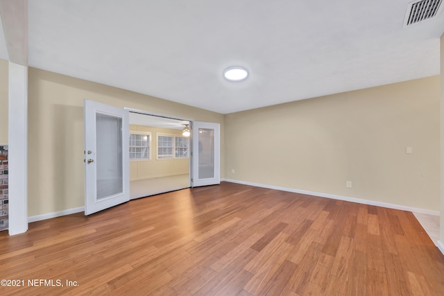 unfurnished room with light wood-type flooring