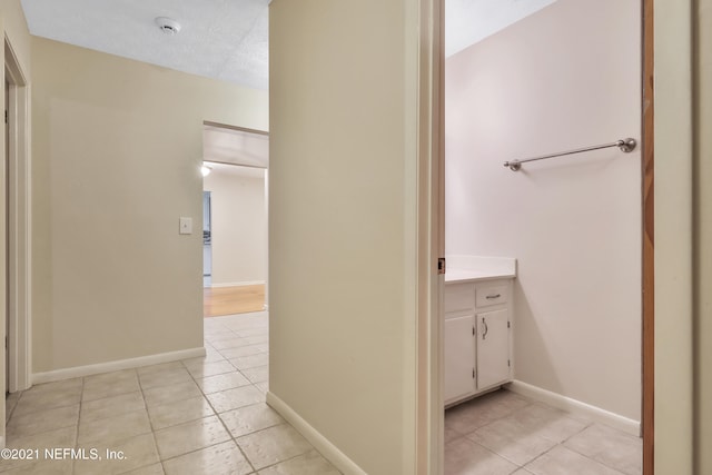 bathroom featuring vanity, a textured ceiling, and tile patterned flooring