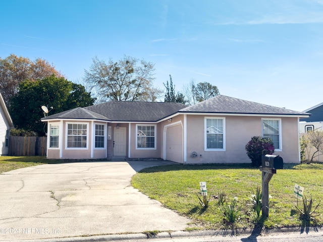 ranch-style home with stucco siding, a front lawn, fence, concrete driveway, and a garage