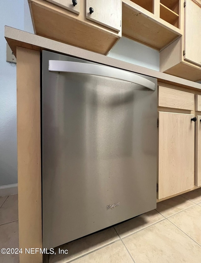 room details featuring dishwasher, light brown cabinetry, and light tile patterned floors