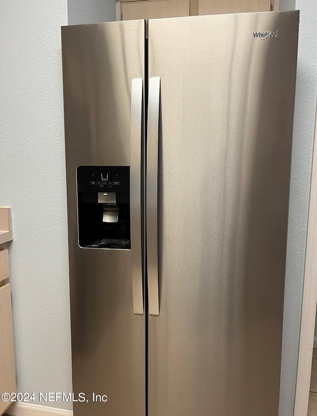 interior details with stainless steel refrigerator with ice dispenser