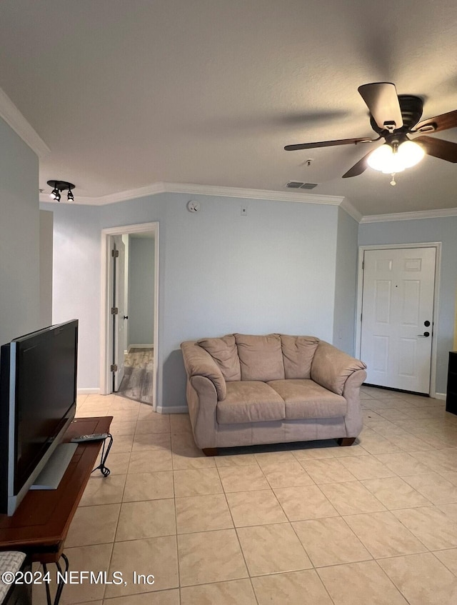 tiled living room featuring crown molding and ceiling fan