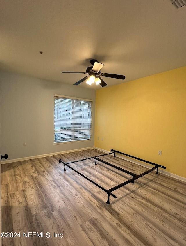 unfurnished bedroom featuring hardwood / wood-style floors