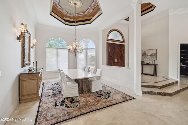 dining area with crown molding and an inviting chandelier