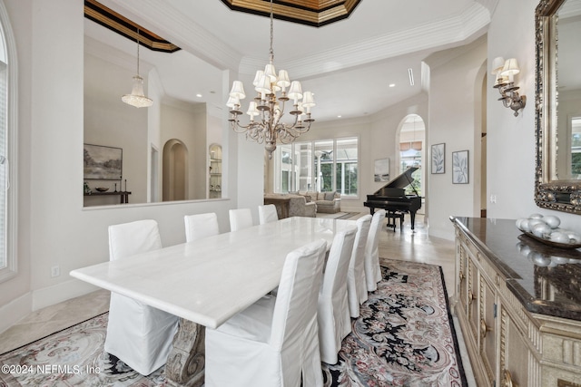 dining space with ornamental molding and an inviting chandelier