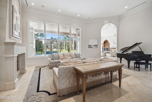 living room with ornamental molding and light tile patterned flooring