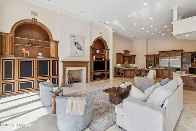 living room with crown molding and built in features