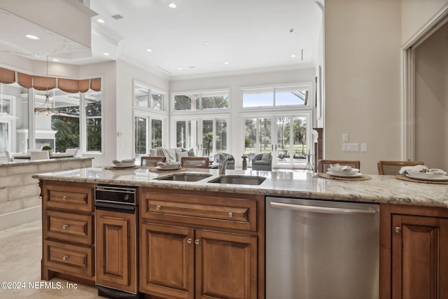 kitchen with light stone counters, crown molding, sink, and stainless steel dishwasher