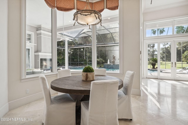 dining room with crown molding and french doors