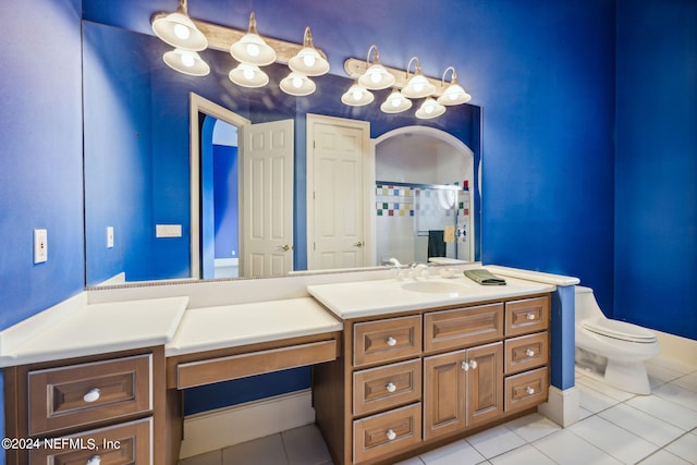 bathroom with vanity, toilet, and tile patterned floors