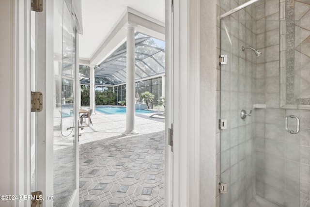 bathroom featuring a shower with door