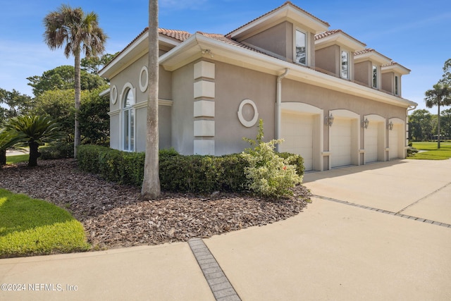 view of side of property with a garage