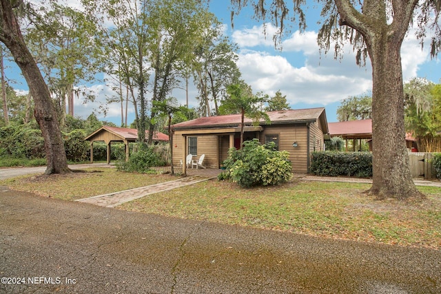 ranch-style home featuring a front yard and a gazebo