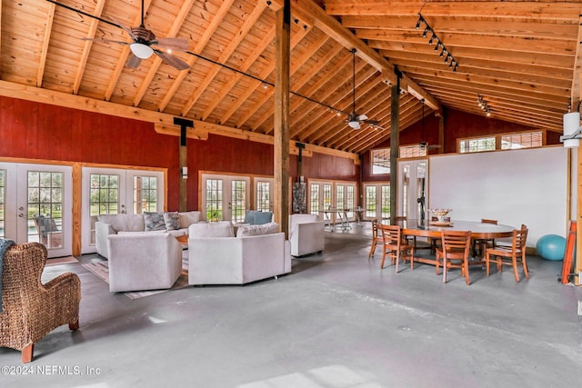 living area featuring concrete flooring, french doors, and a wealth of natural light