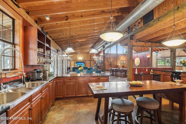 kitchen featuring open shelves, a peninsula, a sink, and wooden ceiling