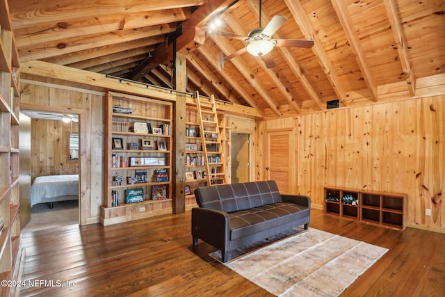 living area featuring a barn door, wooden ceiling, wood-type flooring, vaulted ceiling with beams, and wood walls