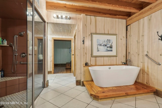 bathroom with wood walls, a stall shower, a soaking tub, and tile patterned flooring