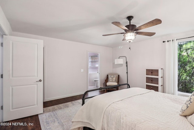 bedroom with ceiling fan, baseboards, and wood finished floors