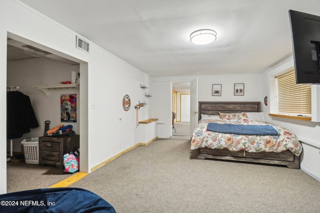 bedroom with carpet flooring, visible vents, and baseboards