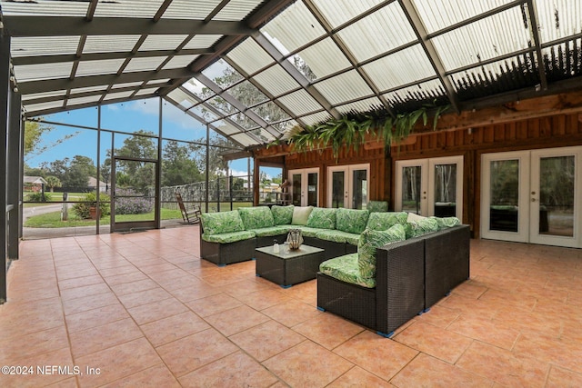 view of patio / terrace with french doors, outdoor lounge area, and a lanai