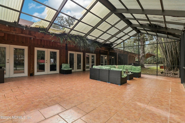 view of patio featuring a lanai, outdoor lounge area, and french doors