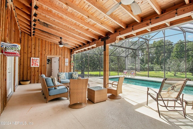 view of patio / terrace featuring a ceiling fan, glass enclosure, and an outdoor pool