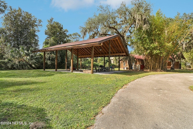 surrounding community with a yard and a gazebo