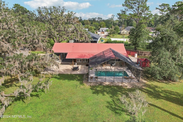 view of swimming pool featuring a patio and a lawn