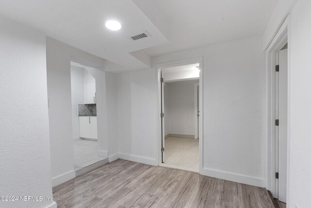 empty room with light wood-type flooring