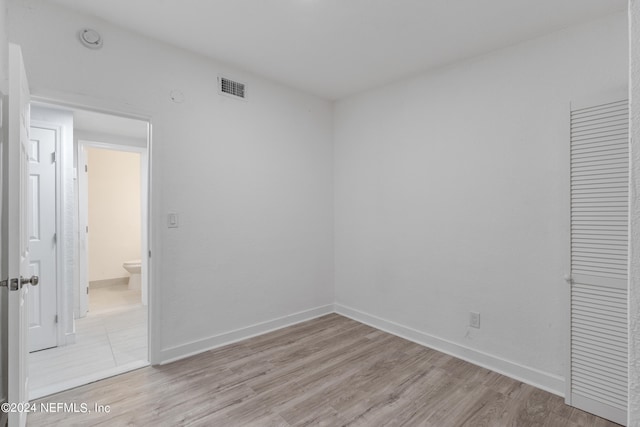 unfurnished room featuring light hardwood / wood-style flooring