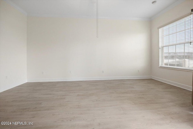 13846 Atlantic Blvd Unit 405, Jacksonville, FL 32225 - unfurnished room featuring crown molding, baseboards, and light wood-type flooring