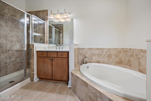 bathroom featuring vanity and plus walk in shower