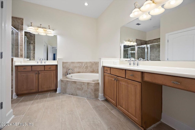 bathroom with tile patterned flooring, shower with separate bathtub, and vanity