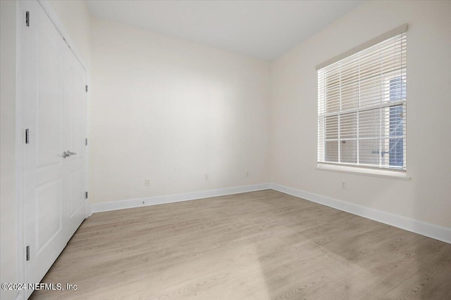 unfurnished room featuring light hardwood / wood-style floors