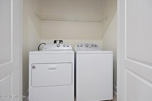 laundry area with washing machine and dryer